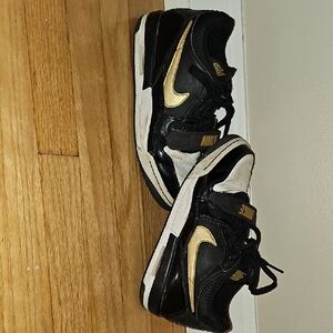 Nike Black and Gold Sneakers High-Top Design